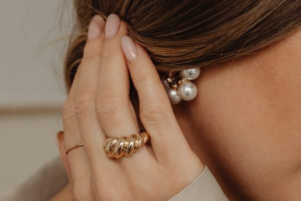 kaboompics_details-of-gold-jewelry-beautiful-woman-wearing-a-tan-silk-shirt-28085